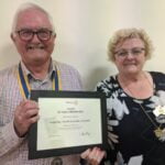 District 9500 Governor Jane Owens presents certificate to President Mervyn to mark the 50th Birthday of The Largs Bay Rotary Club